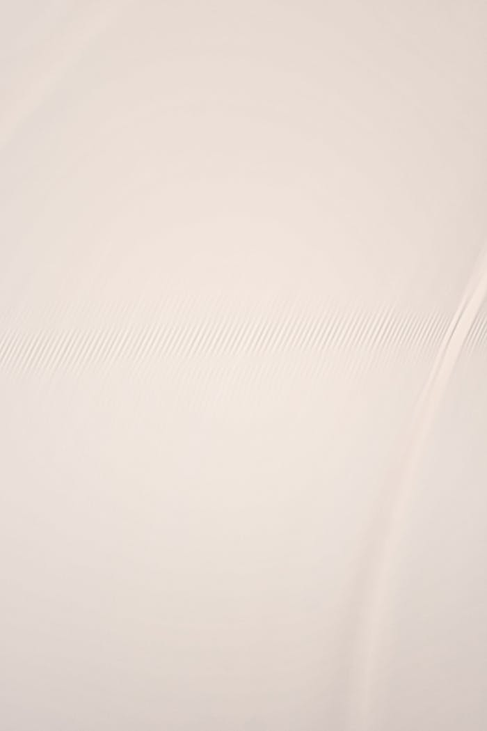 Elegant smooth texture with subtle lines, perfect for background use. Minimalistic design with a warm tone.